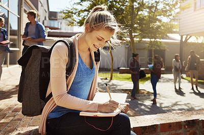 Buy stock photo Portrait of a student studying on campus with other students blurred in the background