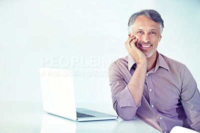 Buy stock photo Portrait, smile and laptop with a mature businessman on a white background in his office for management. Computer, internet and email with a happy manager in the workplace for company research