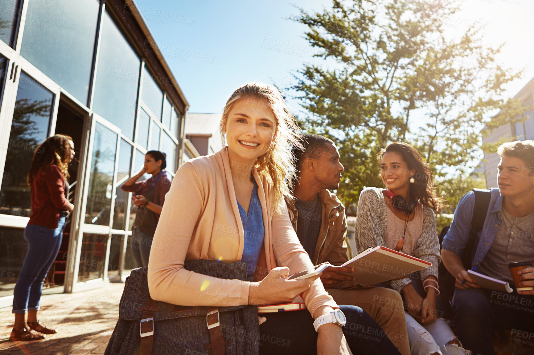 Buy stock photo Portrait of a student studying outside on campus with her classmates