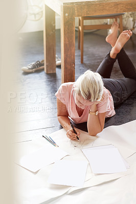 Buy stock photo Shot of a female graphic artist working on illustrations at home