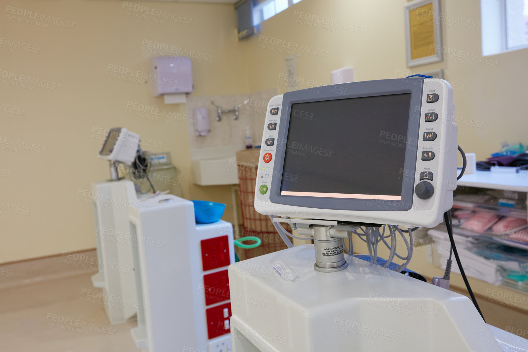 Buy stock photo Shot of monitoring equipment in an empty hospital ward