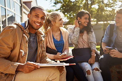 Buy stock photo Portrait of a student studying outside on campus with his classmates
