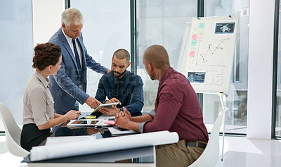 Buy stock photo Shot of businesspeople working in an office