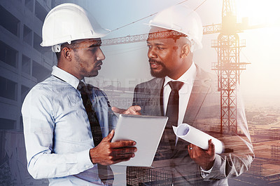 Buy stock photo Shot of two building contractors using a tablet superimposed over a build site