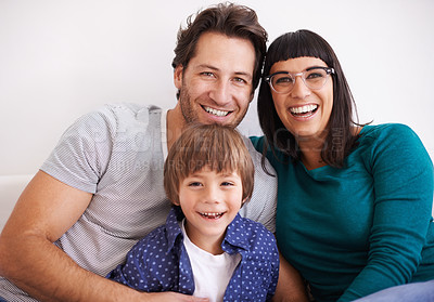 Buy stock photo Happy family, portrait and love on sofa to relax, weekend and bonding together in living room. Parents, children and smile face for affection in trust and care on school vacation to embrace in house