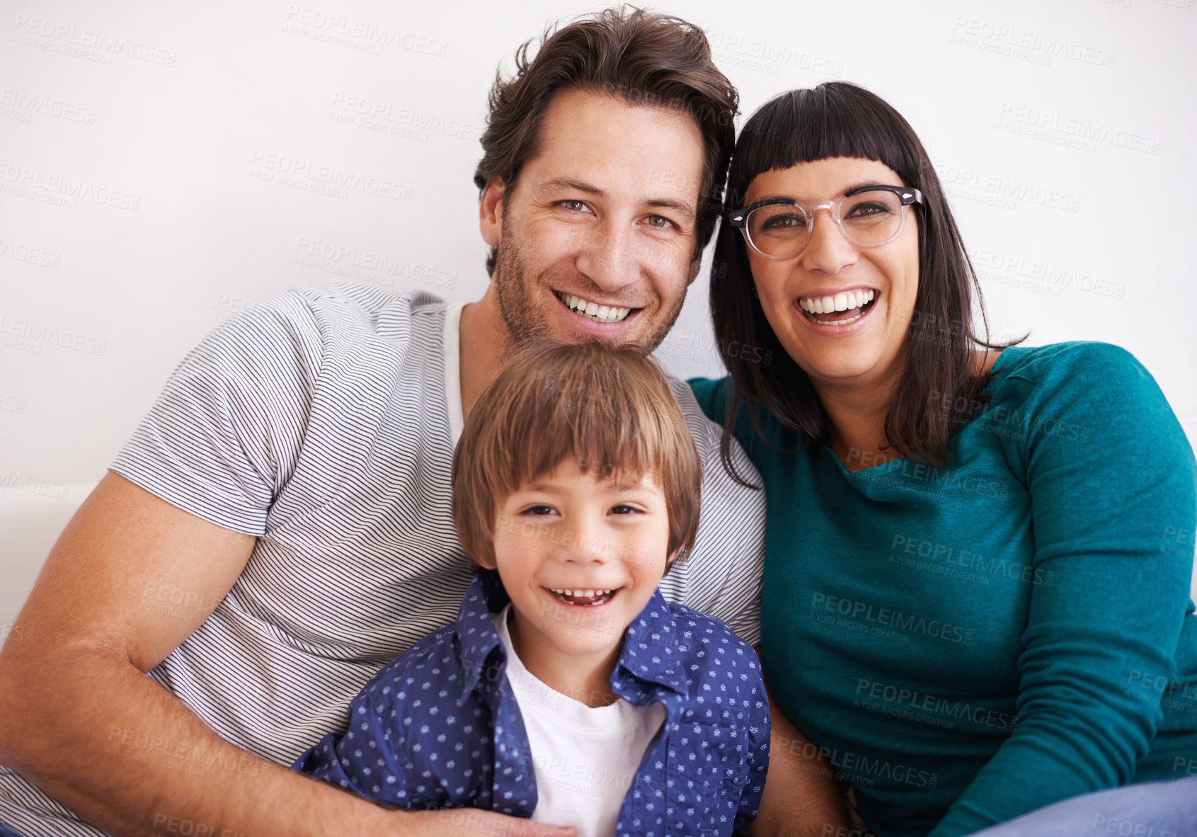 Buy stock photo Happy family, portrait and love on sofa to relax, weekend and bonding together in living room. Parents, children and smile face for affection in trust and care on school vacation to embrace in house