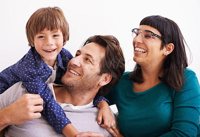 Buy stock photo Happy family, portrait and love on sofa to relax, weekend and bonding together in living room. Parents, boy child and smile face for affection in trust, embrace and parent support on vacation in home