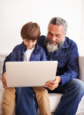 Buy stock photo Grandfather, son and laptop on sofa with love and bonding together with online games in living room. Happy family, boy and computer for cartoons in lounge, relax and movie subscription on holiday