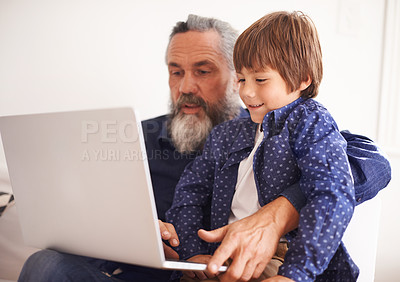 Buy stock photo Grandfather, laptop and boy child for elearning, playing and bonding in living room. Happy family, relax and internet for games or learning online, childhood or development or streaming on technology