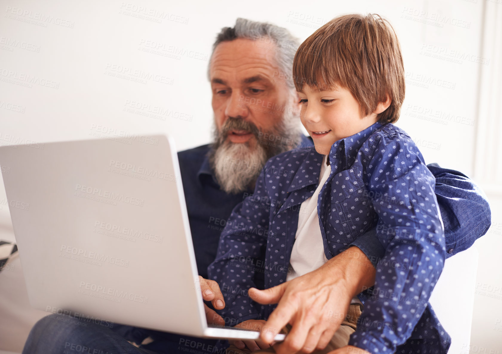 Buy stock photo Grandfather, laptop and boy child for elearning, playing and bonding in living room. Happy family, relax and internet for games or learning online, childhood or development or streaming on technology