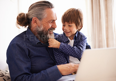 Buy stock photo Smile, boy child and grandfather with beard and laptop, bonding and relax in living room. Happy family, play and fun with grandpa and pulling face hair, elearning and online with computer for learn