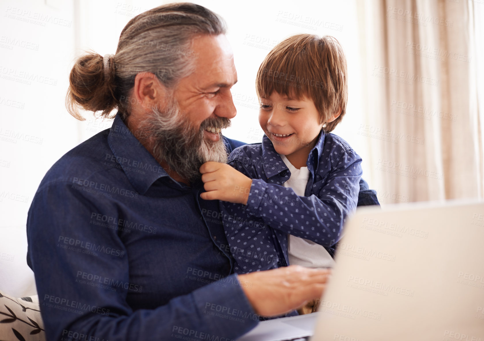 Buy stock photo Smile, boy child and grandfather with beard and laptop, bonding and relax in living room. Happy family, play and fun with grandpa and pulling face hair, elearning and online with computer for learn