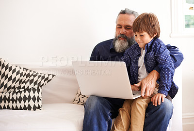 Buy stock photo Grandfather, laptop and boy child for playing, elearning and bonding in living room. Happy family, relax and internet for games or learning online, childhood or development or streaming on technology