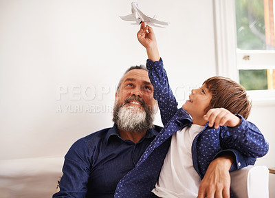 Buy stock photo Grandpa, kid and playing with toy airplane in home, love and bonding together on vacation in living room. Happy family, boy and grandfather with jet game in lounge, relax and care on school holiday
