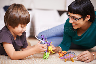 Buy stock photo Mother, child and toy with dinosaur, floor and play for joy or fun at family home or house.  Woman, kid and bedroom with bonding, childhood and future development or growth for happy care together