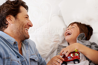 Buy stock photo Cropped shot of a happy father and son bonding at home