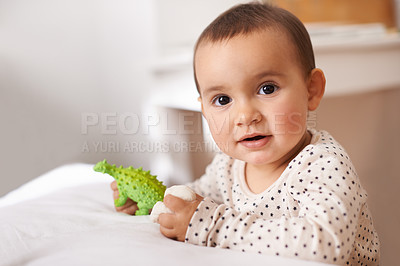 Buy stock photo Baby, portrait and toy for childhood development in home nursery for playing game, relax or weekend. Kid, face and dinosaur in apartment for wellness growth or educational fun, learning or happiness