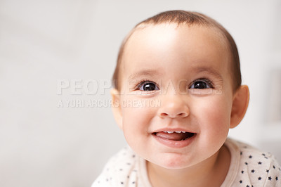 Buy stock photo Cropped shot of an adorable baby girl at home