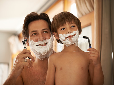 Buy stock photo Father, son and teaching for shave, bathroom and mentor with healthy hygiene or routine. Man, child and skincare for smile, growth or childhood development or bonding with razor and concentration