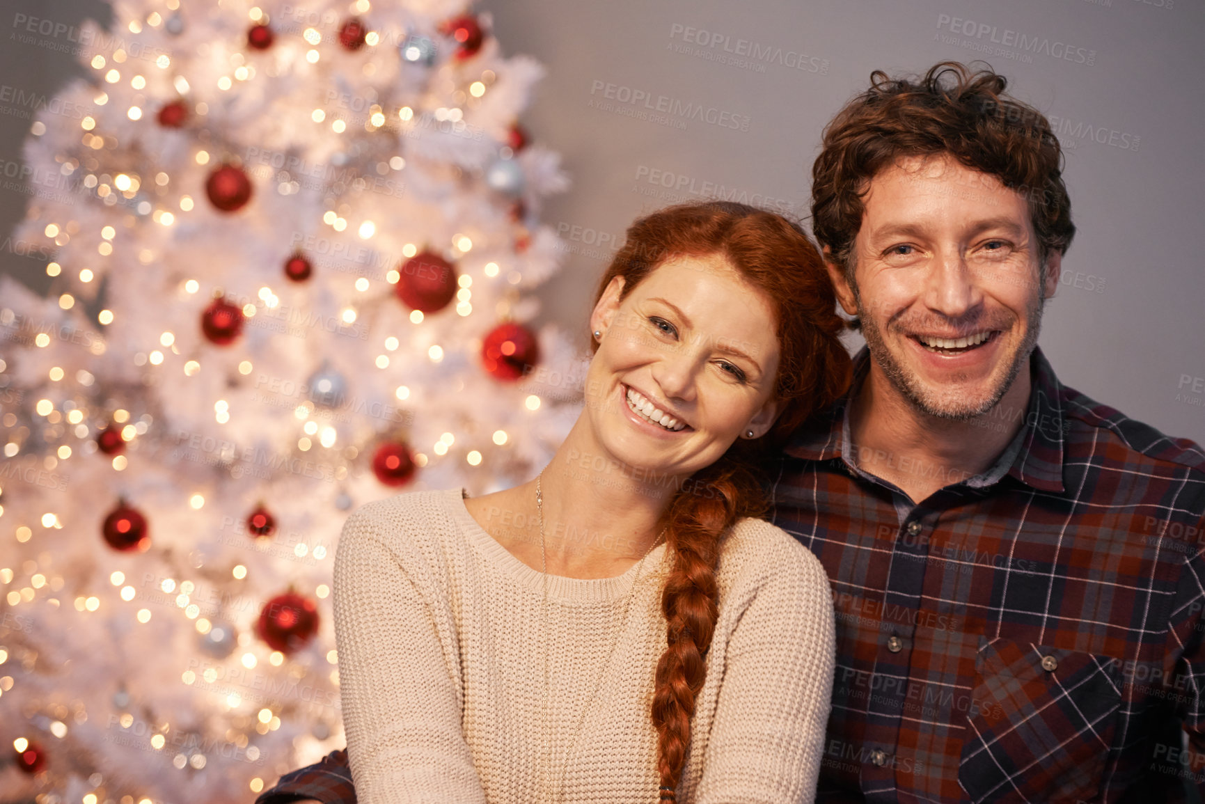 Buy stock photo Christmas, tree and portrait of couple together with love for holiday in home, smile and happiness. Marriage, woman and man as husband and wife in house for celebration of festive, season and romance