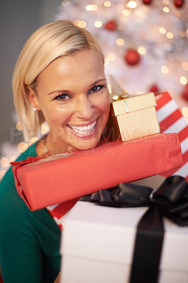 Buy stock photo Woman, portrait and Christmas gifts at tree for holiday giving for festive season celebration, event or packaging. Female person, face and excited or vacation break with present, giveaway or prize 