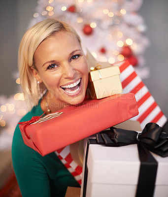Buy stock photo Portrait of an attractive young woman holding her Christmas gifts