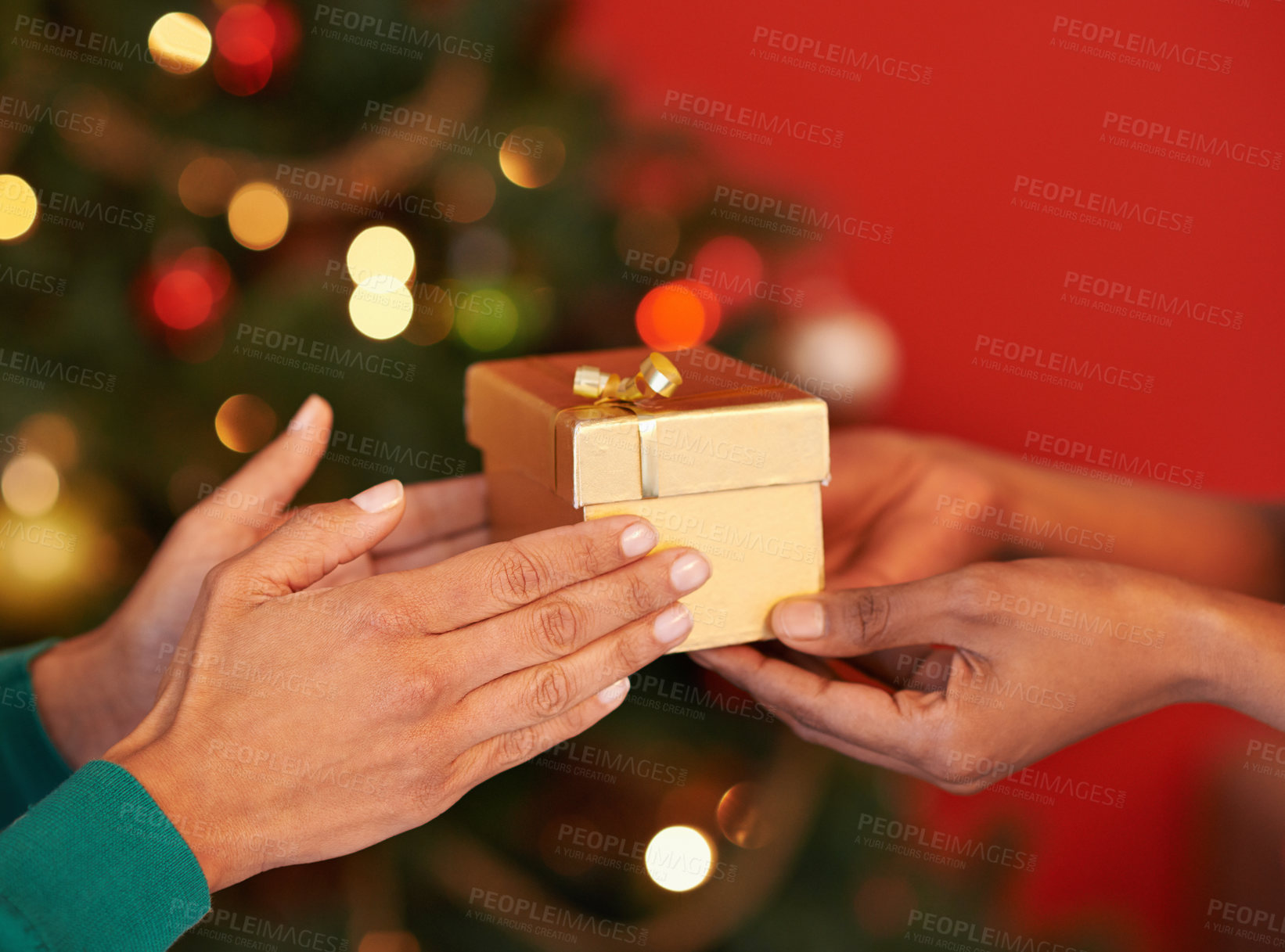 Buy stock photo Closeup, hand or gift at Christmas as love, friends or peace in celebration, gratitude or kindness. People, light or box as thank you, blessing or care as tradition of appreciation and religion