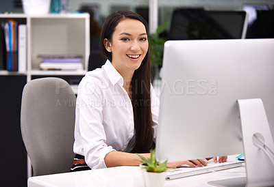 Buy stock photo Portrait of an attractive young businesswoman working at her desk