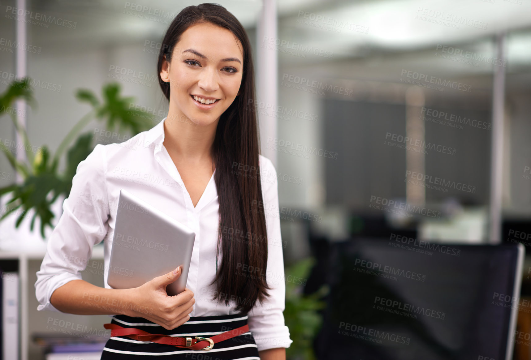 Buy stock photo Portrait of an attractive young woman holding a digital tablet in the office