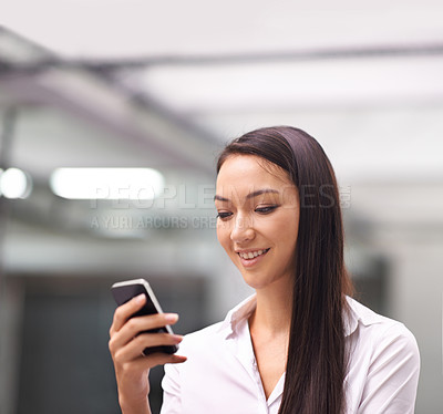 Buy stock photo Cellphone, smile and business woman in office networking on social media, mobile app or internet. Communication, research and professional Asian female person reading email on a phone in workplace.