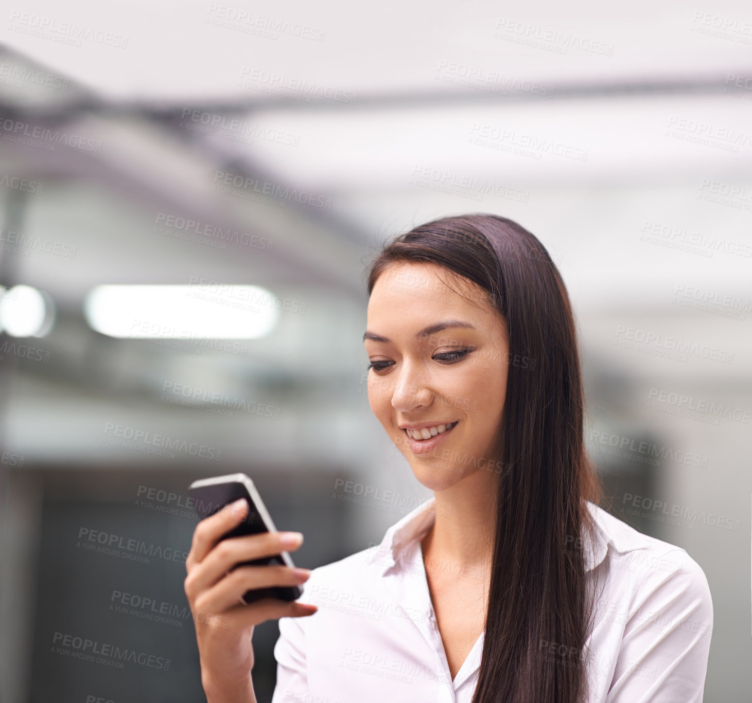 Buy stock photo Cellphone, smile and business woman in office networking on social media, mobile app or internet. Communication, research and professional Asian female person reading email on a phone in workplace.