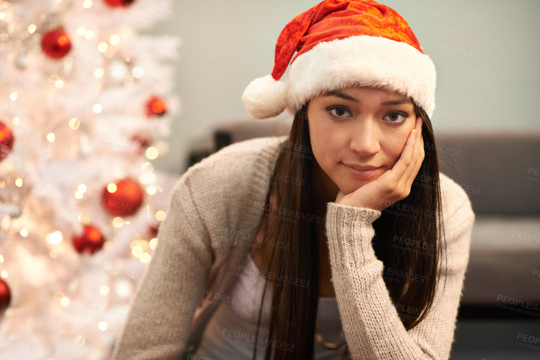 Buy stock photo Portrait, bored and Christmas with unhappy woman in living room of home for lonely celebration. Depression, sad or frustrated and young person with Santa hat in apartment for December holiday season