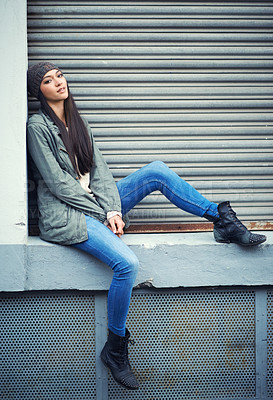 Buy stock photo Woman, fashion and jeans with portrait, urban and city street or background for style. Female student, beanie and jacket in cape town with winter, cold and lazy with metal garage door for confidence