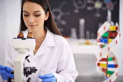 Buy stock photo Medical, microscope and scientist in laboratory for research, chemistry and innovation for scientific career. Woman, worker and expert with dna model, sample and analytics of molecule for experiment