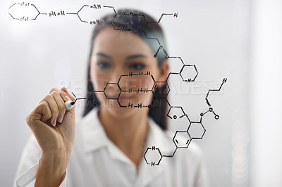 Buy stock photo Cropped shot of a female scientist drawing up a molecule