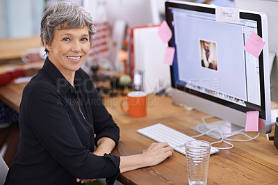 Buy stock photo Portrait of a mature woman sitting at her desk in an office