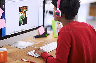 Buy stock photo Shot of a young female designer working on a desktop computer