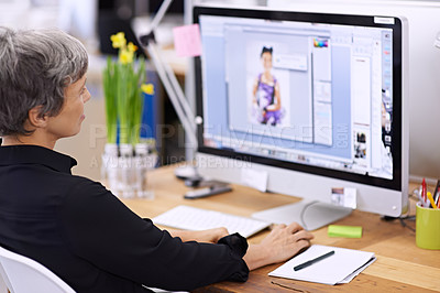 Buy stock photo Shot of a mature female designer working on a desktop computer