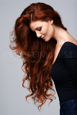Buy stock photo Woman, haircare and healthy with treatment in studio on grey background with satisfied look and confidence. Red hair, female person and wellness with conditioner for routine, repair and fresh 