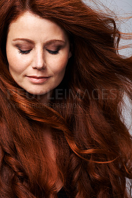 Buy stock photo Hair, beauty and face of redhead woman in studio for keratin treatment, wellness and haircare on gray background. Salon, hairdresser and female model with natural shine, healthy and red hairstyle