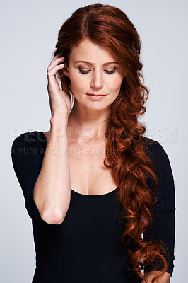 Buy stock photo Beauty, haircare and cosmetic treatment for female person, spa and salon on studio background. Curly, healthy hair and texture for Scottish woman model, hand and keratin for redhead or ginger lady