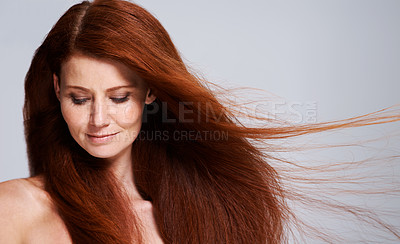 Buy stock photo Hair care, red head and woman with wind for keratin treatment, wellness and beauty on white background. Salon, hairdresser and female model face with shine, healthy and natural hairstyle in studio