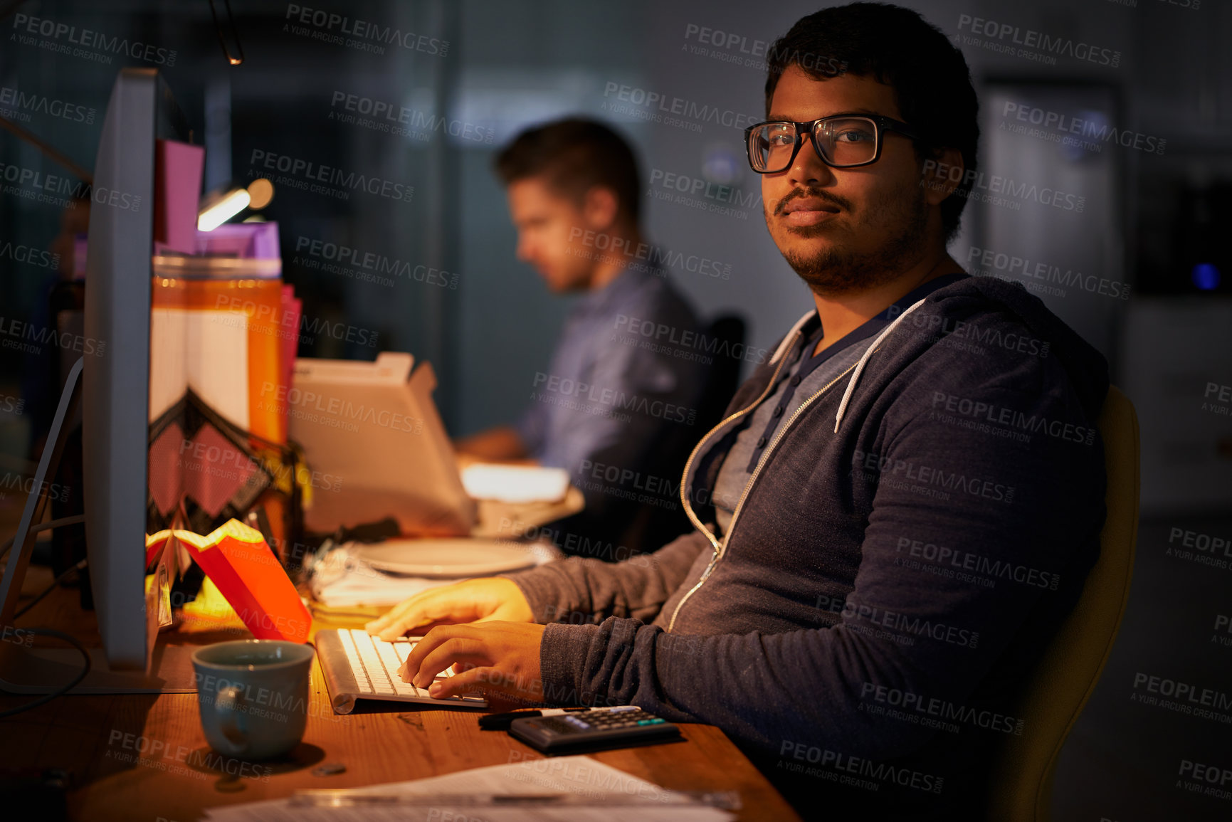 Buy stock photo Portrait, male programmer and late night with computer, deadline and online worker. Dark, person or digital internet specialist in evening for work, office and tech expert or coding in workplace
