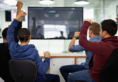 Buy stock photo Rear view of a group of men cheering while watching sports