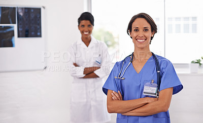 Buy stock photo Cropped shot of two attractive young female doctors