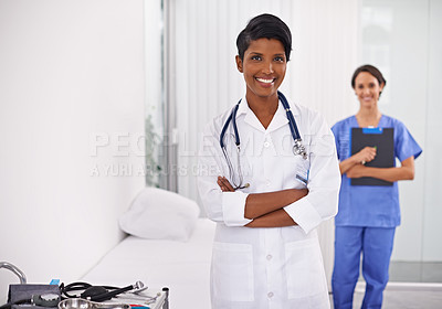 Buy stock photo Cropped portrait of two attractive young female doctors