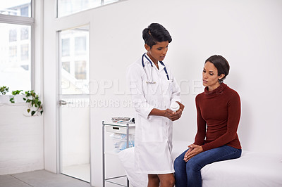 Buy stock photo Shot of a female medical professional explaining to her patient how the medication works
