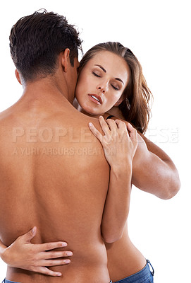 Buy stock photo Studio shot of a shirtless couple embracing against a white background