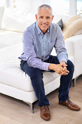 Buy stock photo Senior, man and portrait for relax on couch with happiness, retirement and wellness in living room. Elderly, person and face with smile, confidence and peaceful in lounge of apartment on the weekend