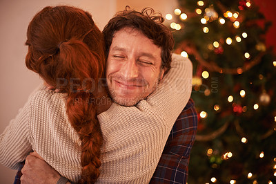 Buy stock photo Couple, Christmas and hug to celebrate holiday, festive season of giving for love and commitment. Happiness, gratitude and support with people at home, romance and relationship with peace together